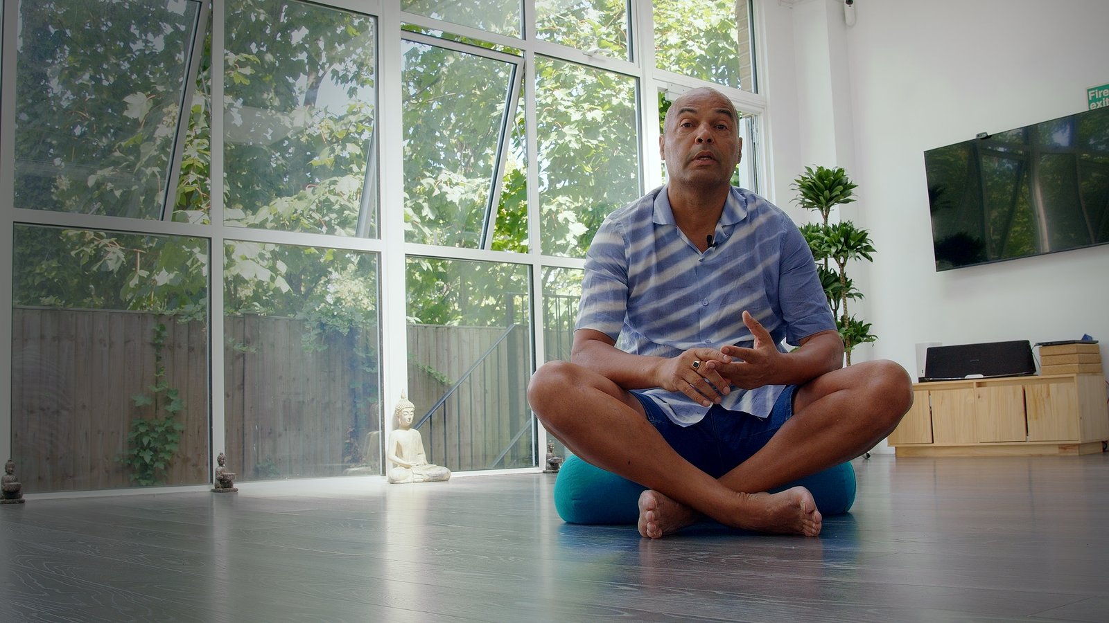 Ray seated in the Phoenix Yoga studio