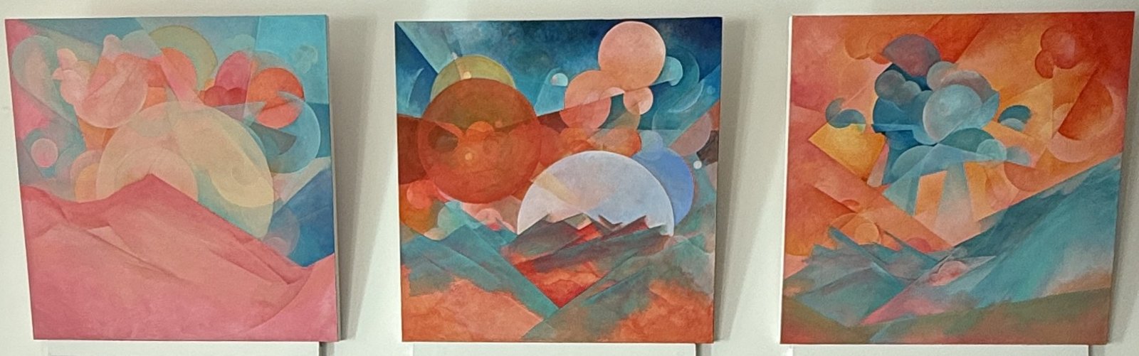 Three colourful abstract paintings displayed at Phoenix Yoga